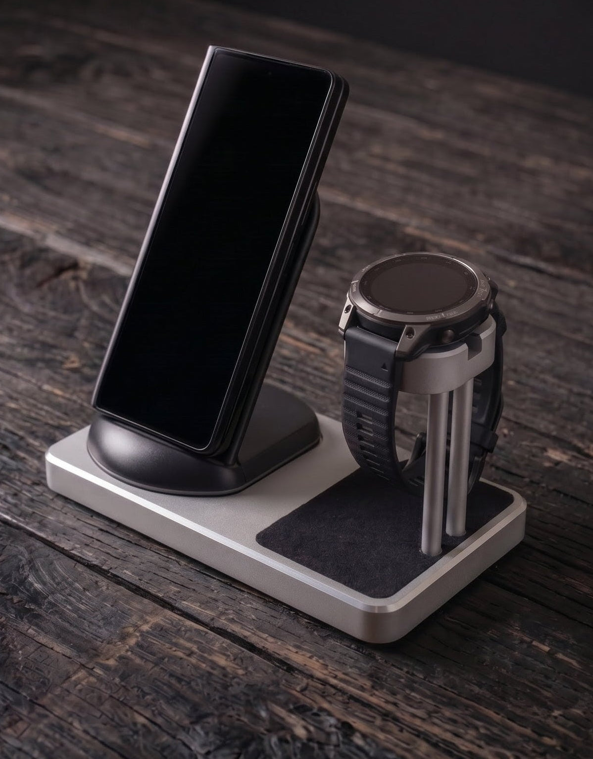 Phone and smartwatch on a charging stand on a wooden surface